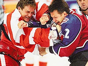 In this file photo, It took all of three seconds into a NHL game here before Darren McCarty, left, of the Red Wings and Claude Lemieux of the Colorado Avalanche started fighting. (Windsor Star files)