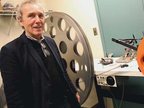 Windsor International Film Festival executive director Peter Coady is photographed next to a film reel on the last night of the festival on Sunday, November 11, 2012 at the Capitol Theatre. (The Windsor Star)