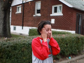 WINDSOR, ONT.:NOVEMBER 10, 2012 -- Michelle Letts, the resident at 1092 Ellis Street east, reacts after being told of the damage to her house after firefighters extinguished a kitchen fire in her home, Saturday, Nov. 10, 2012. (DAX MELMER/The Windsor Star)