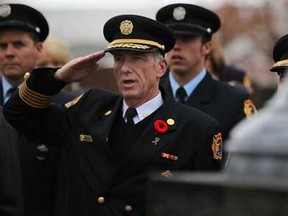Windsor Fire Chief Bruce Montone salutes during a ceremony following the  annual Fallen Fire Fighters Memorial March at Windsor Grove Cemetery, Sunday, Nov. 4, 2012.  (DAX MELMER/The Windsor Star)