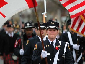Active and retired firefighters participate in the annual Fallen Fire Fighters Memorial March as they march down Giles Boulevard East in Windsor, Ont., Sunday, Nov. 4, 2012.  (DAX MELMER/The Windsor Star)