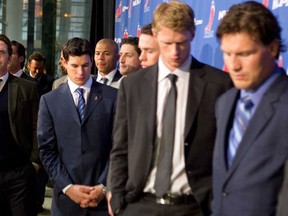 Detroit Red Wings' Dan Cleary, left, Pittsburgh Penguins' Sidney Crosby, Calgary Flames' Jarome Iginla, Carolina Hurricanes' Eric Staal and Pheonix Coyotes' Shane Doan join other NHL players as they leave a press conference following collective bargaining talks in Toronto on Thursday, October 18, 2012. Negotiations continue between the NHL and the NHLPA to end the current lockout. (THE CANADIAN PRESS/Chris Young)