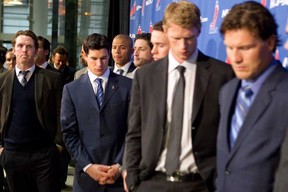 Detroit Red Wings' Dan Cleary, left, Pittsburgh Penguins' Sidney Crosby, Calgary Flames' Jarome Iginla, Carolina Hurricanes' Eric Staal and Pheonix Coyotes' Shane Doan join other NHL players as they leave a press conference following collective bargaining talks in Toronto on Thursday, October 18, 2012. Negotiations continue between the NHL and the NHLPA to end the current lockout. (THE CANADIAN PRESS/Chris Young)