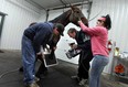 Files: Tim Myers, left, Dr. Mark Biederman and Vanessa Young X-ray a horse's leg at the Biederman Equine Clinic in Lakeshore, Ont. on November 1, 2012.    (TYLER BROWNBRIDGE / The Windsor Star)