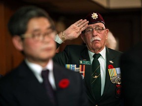 Korean War veteran William Lappan salutes at a Turn To Busan ceremony held at the Legion Branch 255 at 5646 Wyandotte St. E. Saturday, Nov. 10, 2012, in Windsor, Ontario. The ceremony is held for Korean War veterans and coincides with a service in Korea. (KRISTIE PEARCE/ The Windsor Star)