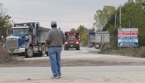 In this file photo, Puce Road resident  Dennis Patrick stands on a neighbour's driveway across from  the Town of Lakeshore Landfill Site on Puce Road in Lakeshore, Ont. on October 1, 2012.   Area residents are upset with current conditions where trucks enter the landfill site.  (JASON KRYK/ The Windsor Star)