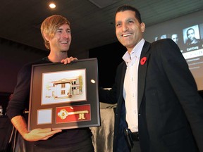 Techno artist Richie Hawtin, left, receives the ceremonial keys to the city from Windsor Mayor Eddie Francis, Wednesday, Nov. 7, 2012, at the University of Windsor.  (DAN JANISSE/The Windsor Star)