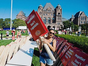 Teachers protest at Queen's Park in this file photo. (Aaron Vincent Elkaim/Canadian Press)