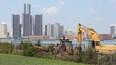 In this file photo, crews work to remove a stretch of tracks from the riverfront in Windsor, Ont. on Wednesday, August 15, 2012.             (The Windsor Star / TYLER BROWNBRIDGE)