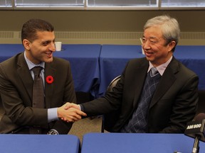 Windsor mayor Eddie Francis, left, meets with Xia Chao Ying,  a representative of the Economic Committee of Hunan Province, China,  during a photo opportunity at Windsor City Hall on November 6, 2012.  (JASON KRYK/ The Windsor Star)