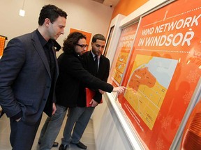 Wind Mobile CEO Anthony Lacavera, left, speaks with Nenos Gebo and Fadi Soultan during the opening of Wind Mobile at Devonshire Mall in Windsor, Ont. on Wednesday, November 21, 2012.                  (TYLER BROWNBRIDGE / The Windsor Star)