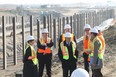 Bob Chiarelli, Ontario Minister of Transportation,  MPP Teresa Piruzza,  Fausto Natarelli, Director of MTO's Windsor Border Initiatives Implementation Group, and Garfield Dales, manager of project delivery for the transportation ministry,  tour the  Windsor-Essex Parkway project in LaSalle, Ontario between Howard Avenue and Cousineau Road on November 22, 2012. (JASON KRYK/ The Windsor Star)