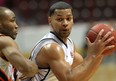 Windsor's Anthony Johnson, right, makes a move in the paint against Summerside's Antonio Ballaard at the WFCU Centre. (NICK BRANCACCIO/The Windsor Star)