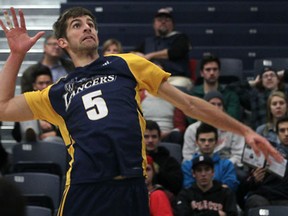University of Windsor's Kyle Williamson spikes the ball against the McMaster Marauders in OUA men's volleyball at the St. Denis Centre Saturday. (DAX MELMER/The Windsor Star)
