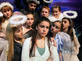 A saddened Willow, centre right, played by Danielle Beauchamp, is comforted by Angel played by Tawnya Clarke and other misfits from heaven during Brian Raisbeck's Beyond the Moon -- A Christmas Fantasy at Capitol Theatre November 27, 2012.  The show features original songs by Windsor's Julie Kryk. (NICK BRANCACCIO/The Windsor Star)