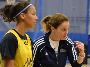 Lancers points guard Korissa Williams, left, talks with coach Chantal Vallee during practice Monday at the St. Denis Centre. (Alanna Kelly/Special to The Star)