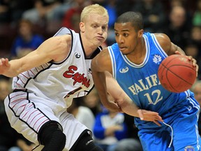 Windsor's Raymond Kraeme, left, guards Halifax point guard Darren Duncan at the WFCU Centre. Duncan was acquired by the Express in a trade Monday. (DAN JANISSE/The Windsor Star)