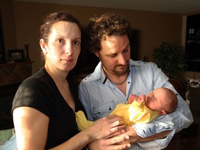 Svetlana and Sean MacPhail of Pigeon Beach near Harrow, Ontario are counting their blessing today with their newborn son, Logan, 7-days-old, after narrowly missing serious injuries when an elderly lady lost control of her vehicle in a Walmart parking lot . (NICK BRANCACCIO/The Windsor Star)