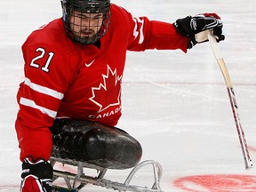 Windsor's Raymond Grassi controls the puck during Canada's game against Italy at the 2010 Vancouver Winter Paralympic Games. (Kevin C. Cox/Getty Images)