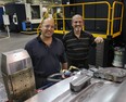 Euclide Cecchin, right, and his son Dave Cecchin pose July 28, 2010, at the Omega Tool Corp. (DAN JANISSE/The Windsor Star)