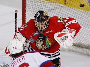 Portland's Mac Carruth, right, allows a goal by Edmonton's T.J. Foster in Game 7 of the WHL championship series last year (Greg Southam/Edmonton Journal)