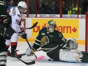 Spitfires forward Derek Schoenmakers, left, is stopped by London goalie Jake Patterson Thursday at the WFCU Centre. (DAN JANISSE/The Windsor Star)