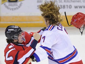 Windsor's Emerson Clark, left, fights former Spit Nick Czinder Friday during the Rangers' 5-1 victory. (Kitchener-Waterloo Record photo)