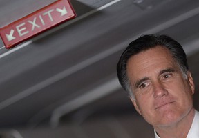 Presidential candidate Mitt Romney talks to journalists on his last leg aboard his campaign plane from Pittsburgh, Pennsylvania to Boston, Massachusetts, November 6, 2012. (DUNAND/AFP/Getty Images)