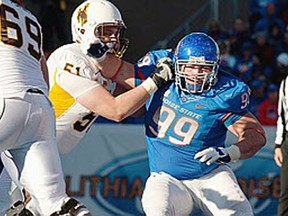 Windsor's Mike Atkinson, right, makes a move in a Boise State football game against Wyoming. (John Kelly photo)