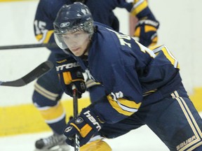 Lancers forward D.J. Turner carries the puck against Laurier at Windsor Arena. (NICK BRANCACCIO/The Windsor Star)