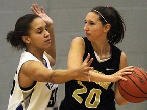 Villanova's Ashli Gibb, left, guards Riverside's Bailey Penny Thursday during the girls basketball final at Villanova. (NICK BRANCACCIO/The Windsor Star)