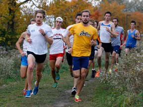 University of Windsor runners Mathew Walters, from left, and Fraser Kegel lead their cross-country teammates at Malden Park. (NICK BRANCACCIO/The Windsor Star)