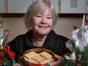 Colleen Campbell, from Stoney Point, displays a tin of her shortbread cookies that she sells in gift shops and to companies and individuals who buy them for gift giving, Tuesday, Nov. 20, 2012.  (DAX MELMER/The Windsor Star)