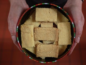 Colleen Campbell, from Stoney Point, displays a tin of her shortbread cookies that she sells in gift shops and to companies and individuals who buy them for gift giving, Tuesday, Nov. 20, 2012.  (DAX MELMER/The Windsor Star)