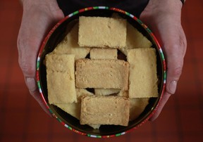 Colleen Campbell, from Stoney Point, displays a tin of her shortbread cookies that she sells in gift shops and to companies and individuals who buy them for gift giving, Tuesday, Nov. 20, 2012.  (DAX MELMER/The Windsor Star)