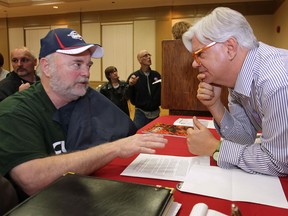 Ontario CUPE president Fred Hahn (R) talks to Bob Trott, a custodian at the Central Public School and member of CUPE local 27 in Windsor, Ont. The meeting was held at the Caboto Club, Thursday, Nov. 22, 2012, and is one of 20 being held across the province.   (DAN JANISSE/ The Windsor Star)