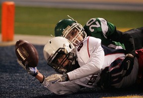 Holy Names Knights Jimmy Lenhart hauls in a touchdown pass against Herman Green Griffins Spencer Trinier just before halftime in Newman Conference Championship game at Alumni Field Thursday November 15, 2012.  The touchdown and point after tied the score at 14. (NICK BRANCACCIO/The Windsor Star)