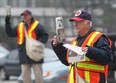 Goodfellows volunteer Don Urban (R) and Bob Parent sell the annual Christmas edition newspapers Thursday, Nov. 24, 2011, at the intersection of Ouellette Ave and Tecumseh Rd.  (DAN JANISSE/The Windsor Star)