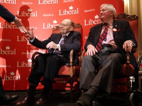 Former Liberal cabinet minister Herb Gray (left) shakes hands as tributes are paid to him as former prime minister John Turner (right) looks on during a tribute in Ottawa, Monday November 19, 2012 to Gray's 50 years of public service. (The Canadian Press/Fred Chartrand )