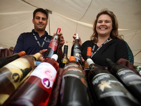 Steve Mitchell and Erica Kolar of Sprucewood Shores Estate Winery display their selection of wine at Tecumseh's 2012 The Art of Eating Food and Wine Festival. (Windsor Star files)