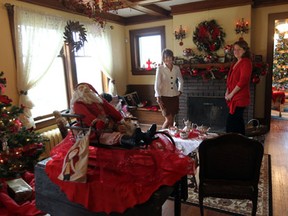 In this file photo, interior decorator Joan Balsam Clark, left, and Mary Baruth, executive director of the Jack Miner Migratory Bird Foundation, pose inside Jack Miner’s family home in Kingsville. The house is part of the Kingsville Christmas Tour this year. (JASON KRYK / The Windsor Star)