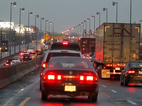 Bumper-to-bumper traffic heading down the ramp from the Ville Marie Expressway into the Turcot yards on westbound Highway 20 in Montreal Wednesday December 21, 2011.  Traffic was slowed by freezing rain in the Montreal region.     (John Mahoney/THE GAZETTE)