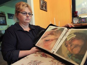 Karen McLean  spent years filing complaints to the Ministry of Health about how her mother was allegedly being treated in long-term care. She poses Thursday, Oct. 4, 2012, at her Windsor home with photos of her mother Elizabeth Kokins. (DAN JANISSE / The Windsor Star)