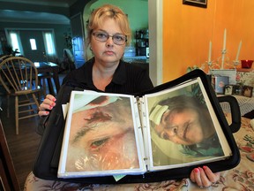 Karen McLean spent years filing complaints to the Ministry of Health about how her mother was allegedly being treated in long-term care. She poses Thursday, Oct. 4, 2012, at her Windsor home with photos of her mother. (DAN JANISSE / The Windsor Star)