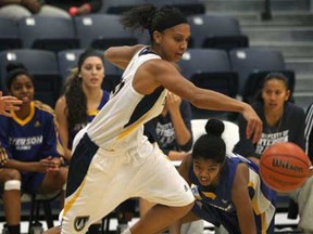 Windsor's Miah-Marie Langlois, left, dribbles past Ryerson's Cassandra Nofuente during their game Friday, Nov. 23, 2012, in Windsor, Ont. (DAN JANISSE/ The Windsor Star)