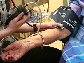 File photo of a nurse taking the blood pressure of an elderly patient. (Windsor Star files)