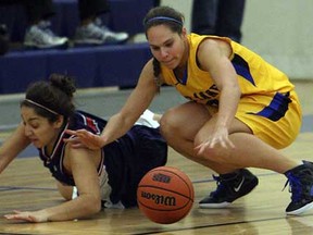 St. Anne's Alana Gyemi, right, battles Holy Names' Natalia Younan during high school basketball action at St. Anne in Lakeshore on Tuesday, October 30, 2012. Gyemi scored 10 points in St. Anne's 52-49 win over St. John's at OFSAA. (TYLER BROWNBRIDGE/The Windsor Star)