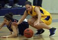 St. Anne's Alana Gyemi, right, battles Holy Names' Natalia Younan during high school basketball action at St. Anne in Lakeshore on Tuesday, October 30, 2012. Gyemi scored 10 points in St. Anne's 52-49 win over St. John's at OFSAA. (TYLER BROWNBRIDGE/The Windsor Star)
