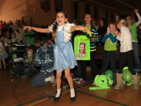 The crowd reacts to the announcement that Lasalle's Danielle Wade is the winner of the Over the Rainbow singing competition. Approximately 400 people assembled in the Sandwich Secondary School gym to watch the final episode. Wade is a graduate of the school.  (DAN JANISSE/The Windsor Star