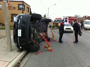 A GMC Acadia rests on its side after rolling over in the 3200 block of Tecumseh Road East on Friday, Nov. 23, 2012. (NICK BRANCACCIO/The Windsor Star)
